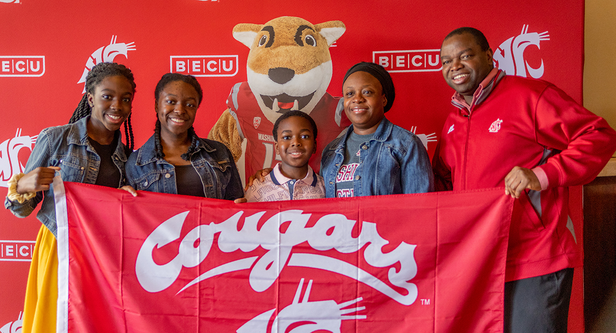family with Cougar flag